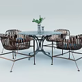 Stylish Round Table And Wicker Chairs Set With Metal Legs And Decorative Plant