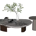 Marble Coffee Table With Glass Vase Green Branches Stacked Plates And Gray Round Side Table