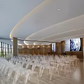 Modern Conference Room With Curved Ceiling Transparent Chairs Wooden Flooring And Projection Screen