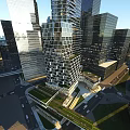Modern Urban Office Building With Glass Facade Surrounded by Skyscrapers and Green Space