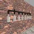 Industrial Rustic Chandelier With Black Pipe Frame And Glass Bottles On Brick Wall
