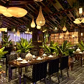 Tropical Restaurant Interior With Hanging Pendant Lights Green Plants And Wooden Ceiling