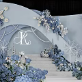 Banquet Hall With Blue And White Floral Decorations Circular Chandelier And Elegant Stage Backdrop
