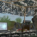 Natural Outdoor Scenery With Camouflage Shelter Sandbags Tires Metal Barrels Trees And Grassland