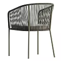 Dark Rattan Leisure Chair With Metal Legs Armrests And Light Cushion