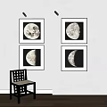 Abstract Moon Phase Paintings with Black Frames on White Wall
