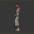 Woman in Blue and White Striped Dress with Crossed Hands Wearing Orange Shoes Gray Background