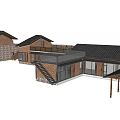 Traditional Two Story Homestay Building With Gabled Roof And Wooden Balcony