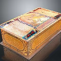 Ornate Golden Decorative Box With Intricate Inlaid Patterns And Colorful Details