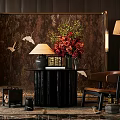 Elegant Black Round Console Table With Floral Arrangement Crane Patterned Backdrop And Table Lamp