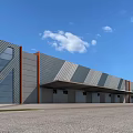 Modern Industrial Factory Building With Gray Orange Metal Panels Sloped Roof And Roll Up Doors