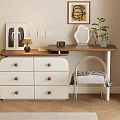 Dresser with White Drawers Wooden Top Table Lamp Green Plant and Chair with Gray Blanket