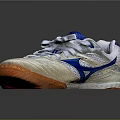 White Athletic Shoes With Blue Logo Orange Sole White Laces And Mesh Upper Design