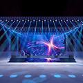 Modern Stage Setup With Colorful Lighting Large LED Screen And Decorative Patterns