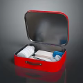 Open Red First Aid Kit With Medical Supplies Bandages And Scissors