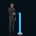 Man in Suit Standing Next to Blue Glowing Activation Device With White Base