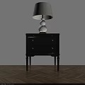 Black Wooden Nightstand With White Table Lamp On Light Wall And Wooden Floor