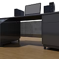 Black Functional Desk With Computer Monitor Speakers Control Panel And Wheels