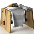 Minimalist Bathroom Accessories with White Tray Soap Black Container and Gray Towel on Wooden Surface