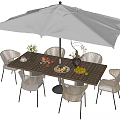 Outdoor Perforated Wooden Table with Large White Umbrella Wicker Chairs and Tableware