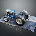 Detailed Vintage Blue Tractor Model with Large Wheels and Metallic Body on Gray Mat