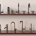 Different Styles Of Black And Gold Faucets Neatly Displayed On Shelves