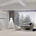 Elegant Bridal Shop Interior With White Walls Arched Doorways And Light Stone Floor