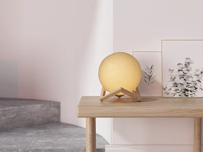 Yellow Globe Table Lamp with Wooden Stand on Wooden Table White Wall and Wall Art 3d model