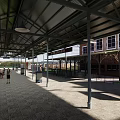 Train Station Platform With Covered Roof Green Train And Tiled Floor