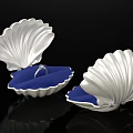 Silver Shell Shaped Display Case With Blue Cushion And Ring Inside 3d model