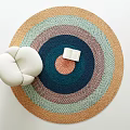 Round Rug With Colorful Layered Design White Cushion And Open Book In Cozy Interior