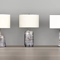 Modern Table Lamps With Transparent Glass And Golden Metal Bases In Various Shapes