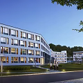 Modern School Building with Large Windows White Facade Green Lawn and Trees