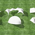 Modern Tensile Membrane Structures In Various Shapes On Green Grass Field