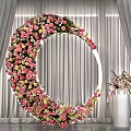 Round Floral Arch With Pink Yellow Flowers Gray Curtains And White Vase