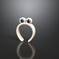 White Frog Head Shaped Decorative Ornament With Black Eyes On Dark Surface