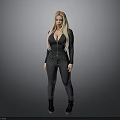 Woman With Blonde Hair In Black Tight Jumpsuit And Black Boots Standing Against Gray Background