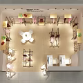 Modern Clothing Store Interior With Organized Racks Display Tables And Decorative Plants