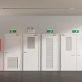 White Emergency Exit Doors With Green Signs And Red Safety Cabinet