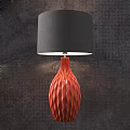 Blue Wavy Base Table Lamp With White Lampshade On Dark Textured Wall