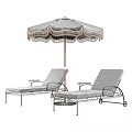 Outdoor Sofa With Striped Cushions And Tasseled Umbrella For Patio Relaxation