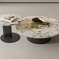 Round Marble Coffee Tables with Black Ribbed Base Featuring Green Cups Metal Tray and Magazine