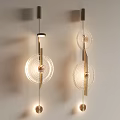 Modern Illuminated Wall Lamps With Circular Glass Shades And Metal Frame Design