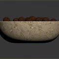 Natural Beige Stone Bowl Filled With Brown Nuts Against Dark Background