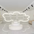Modern Boutique Store Interior With Cloud Shaped Shelves Circular Display Platform Spotlights And Sofa