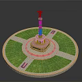 Monument Structure With Golden Statue On Circular Base And Green Lawn Cross Pathways