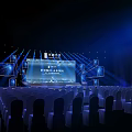 Futuristic Stage Setup With Large Screen Blue Lighting And Audience Seats 3d model