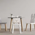 Cute Children's Table And Chairs With Cartoon Bunny Design And Stationery On Wooden Legs