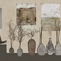 Ceramic Vessels Displayed In Neutral Toned Interior With Artworks And Dried Branches