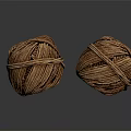 Two Brown Coiled Twine Balls Placed On Black Reflective Surface 3d model